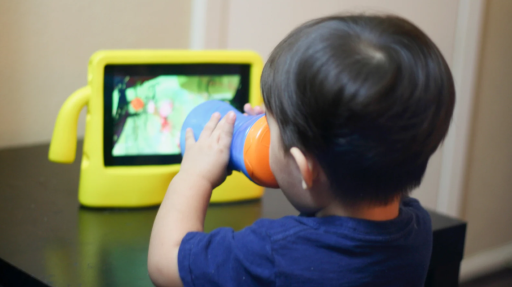 toddler watching a video on ipad